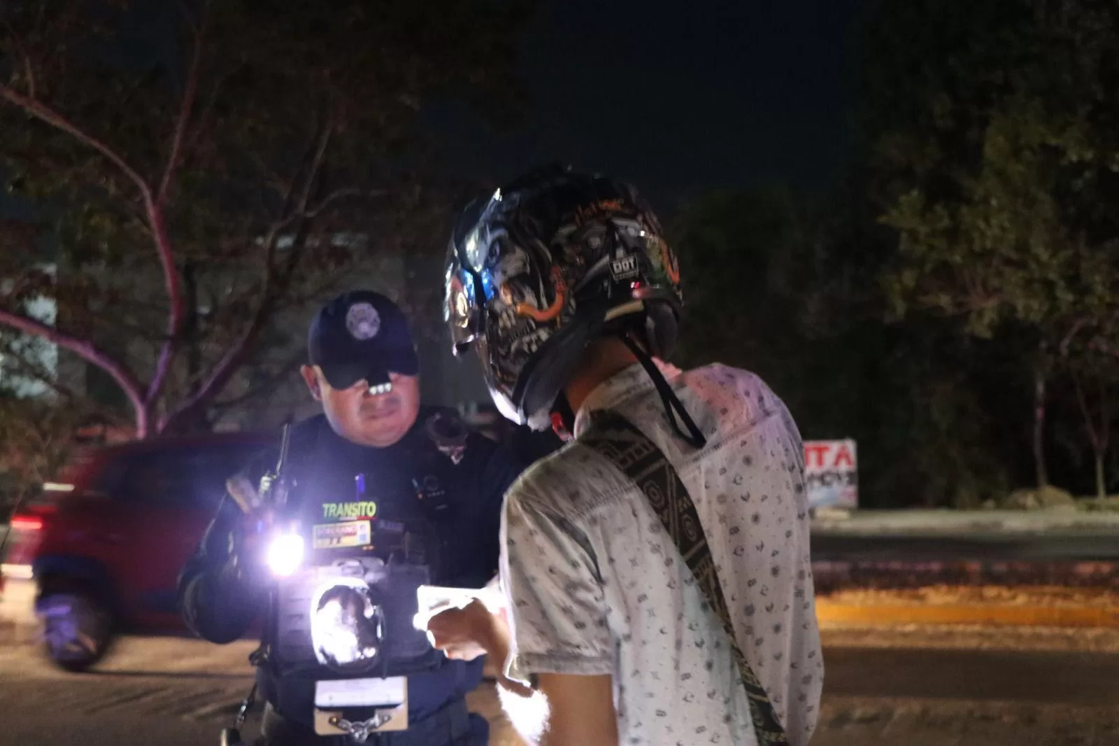 Police officers conducting a traffic stop and breathalyzer test in Playa del Carmen