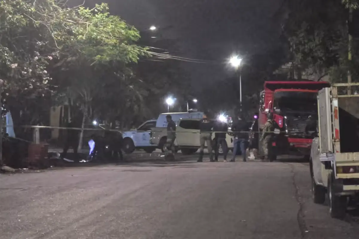 Police and emergency personnel at the scene of a shooting in Playa del Carmen's La Guadalupana neighborhood