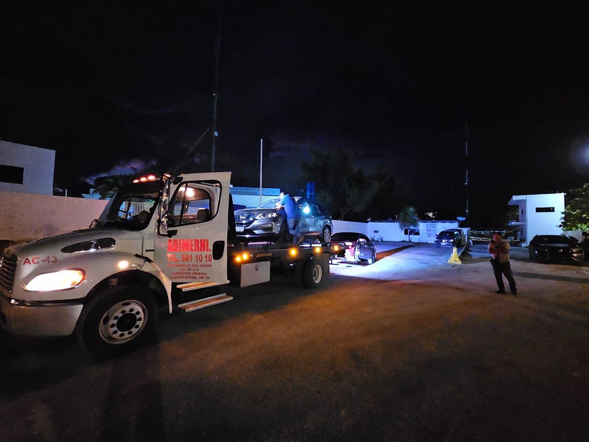 Police vehicles and officers at the Punta Sam ferry terminal in Cancun
