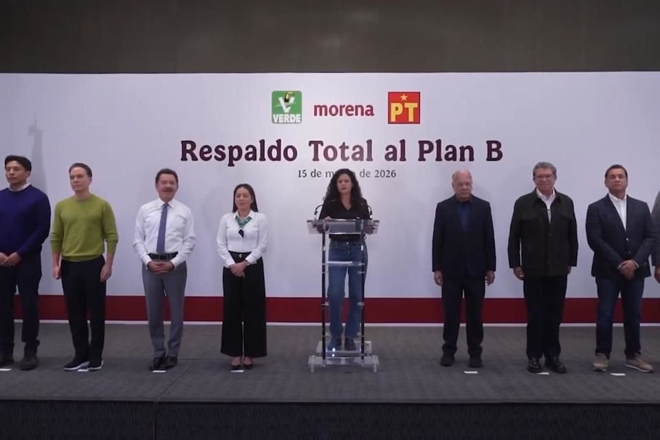 A group of political leaders standing together at a podium during an announcement event in support of Plan B on March 15, 2026.