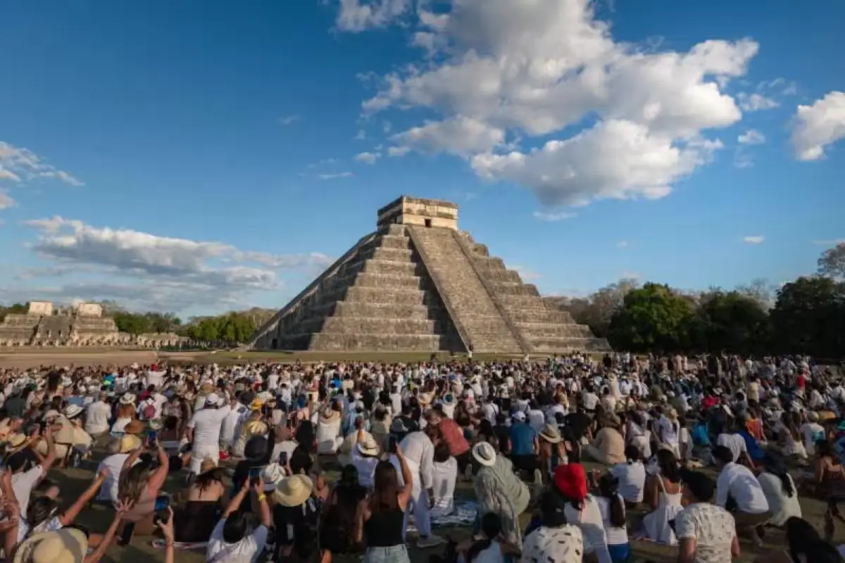 Visitors gather at the base of El Castillo pyramid at Chichén Itzá during the spring equinox