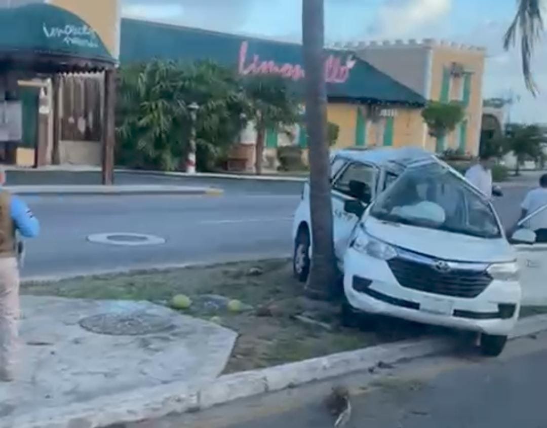 A damaged taxi after crashing into a palm tree on Kukulcan Boulevard in Cancun's Hotel Zone