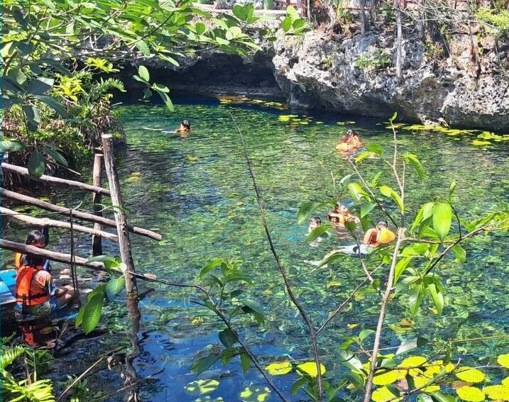 Tourists visiting the Dos Ojos park cenotes in Tulum, Quintana Roo