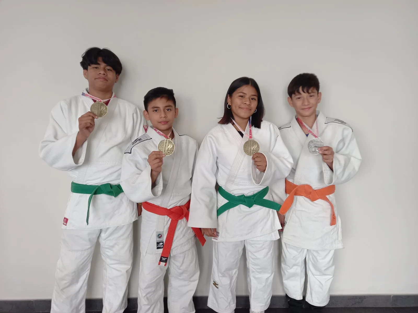 Tulum judokas posing with their medals after the Tomoyoshi Yamaguchi National Judo Tournament
