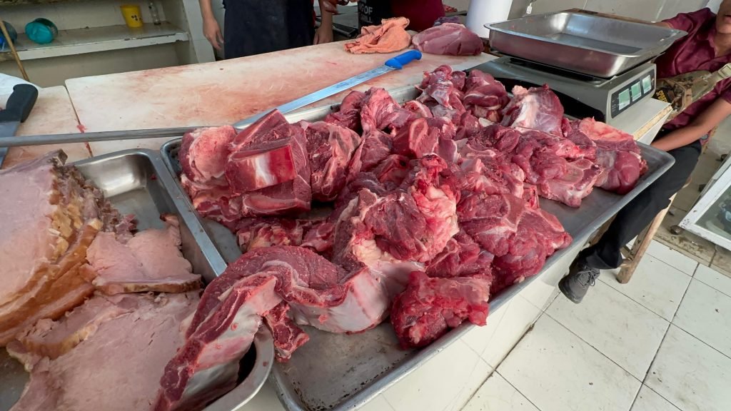 Butchers and fish sellers at Tulum's Cal'axilhil market during Lent season
