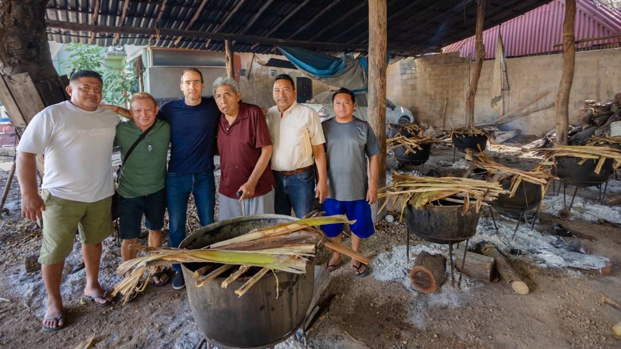 Families participating in the traditional Matán celebration in Tulum, preparing food together