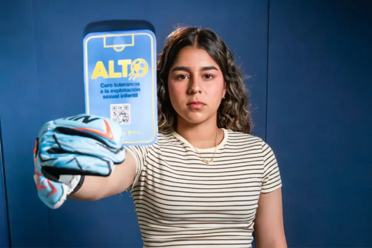 UNICEF representatives holding symbolic blue cards as part of an initiative to protect children