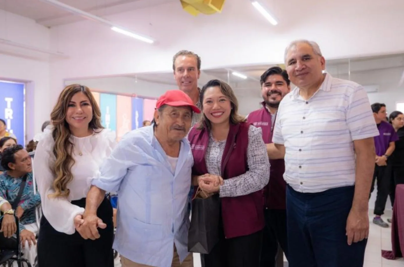Officials and recipients at a prosthetic and orthotic delivery event in Yucatán