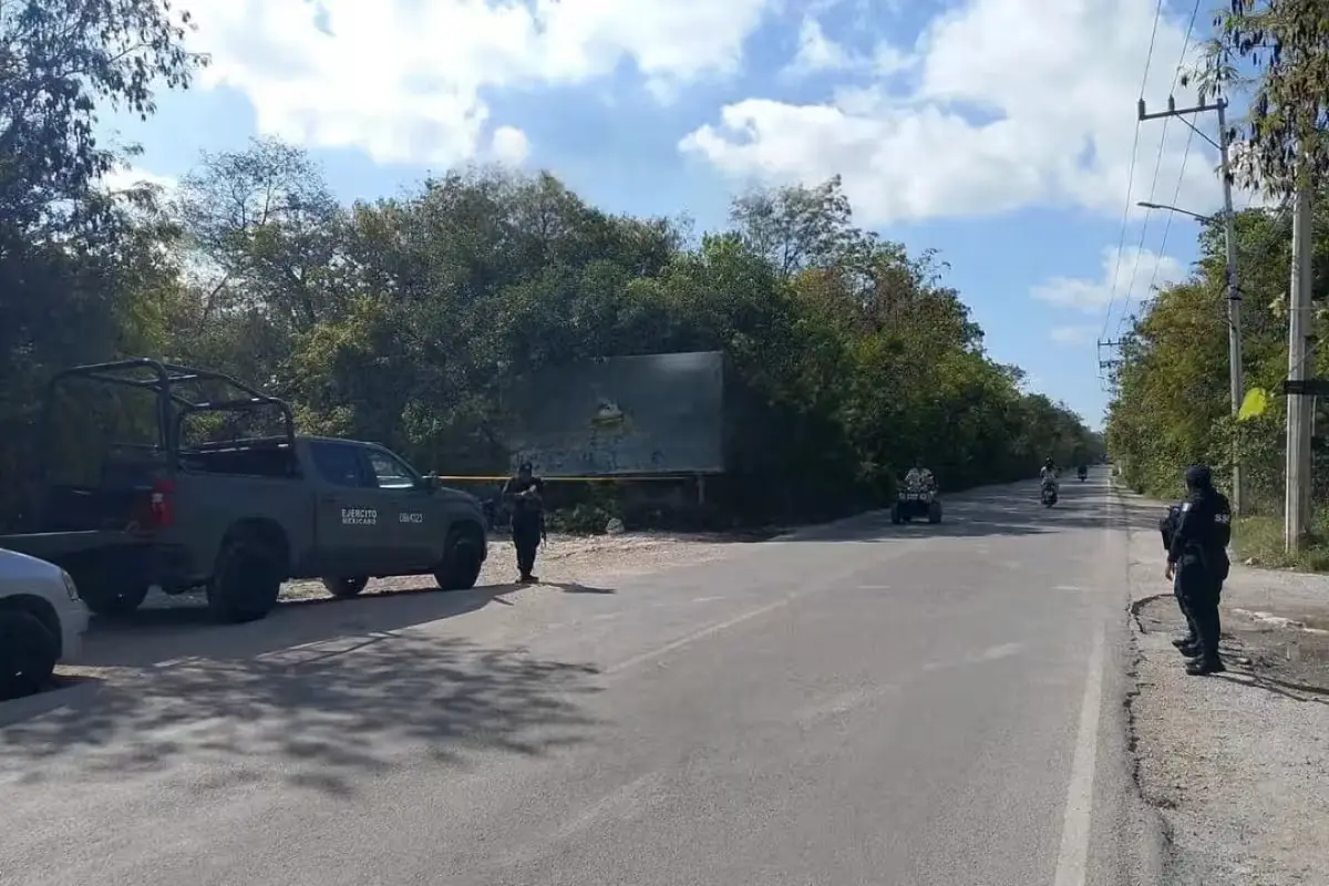 Police and forensic officials at the scene where bags containing human remains were found in the Aldea Zamá development in Tulum