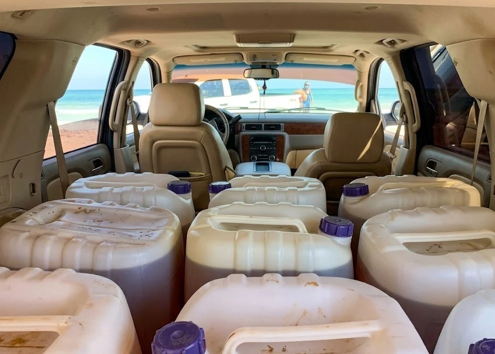 Belize security forces standing near a seized plane in Neufeld, Orange Walk district