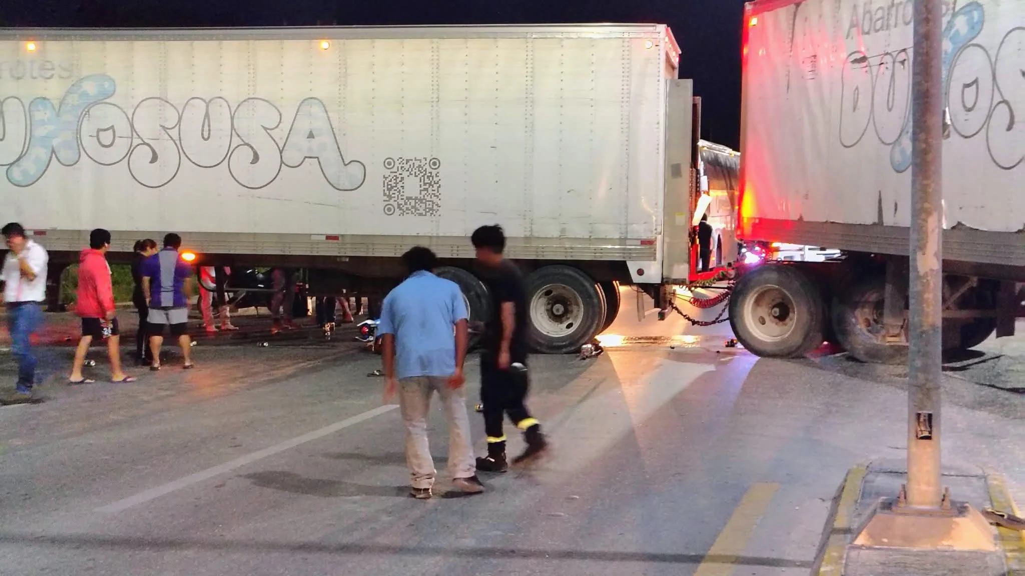 Police and emergency services at the scene of a fatal motorcycle accident on Jose Lopez Portillo Avenue in Cancun