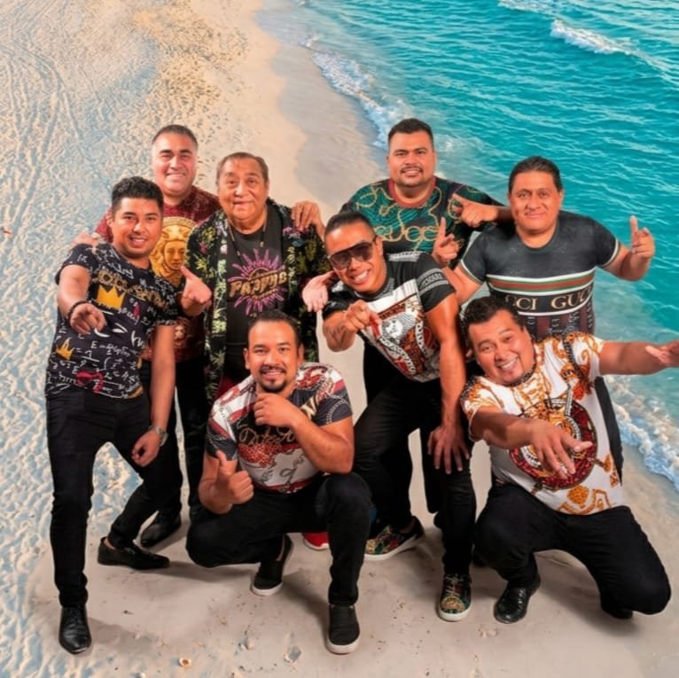 A festive scene in Cancún with people celebrating to music