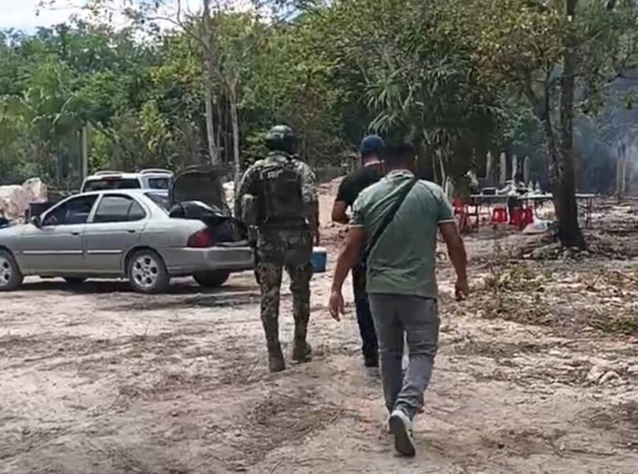 Police tape cordoning off a dirt road in Cancun's Avante neighborhood where a tortured body was found