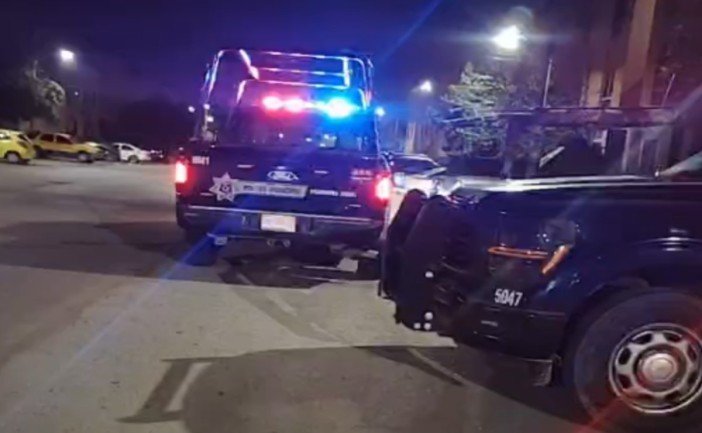Police tape blocking entrance to a house in Cancun after a domestic violence incident