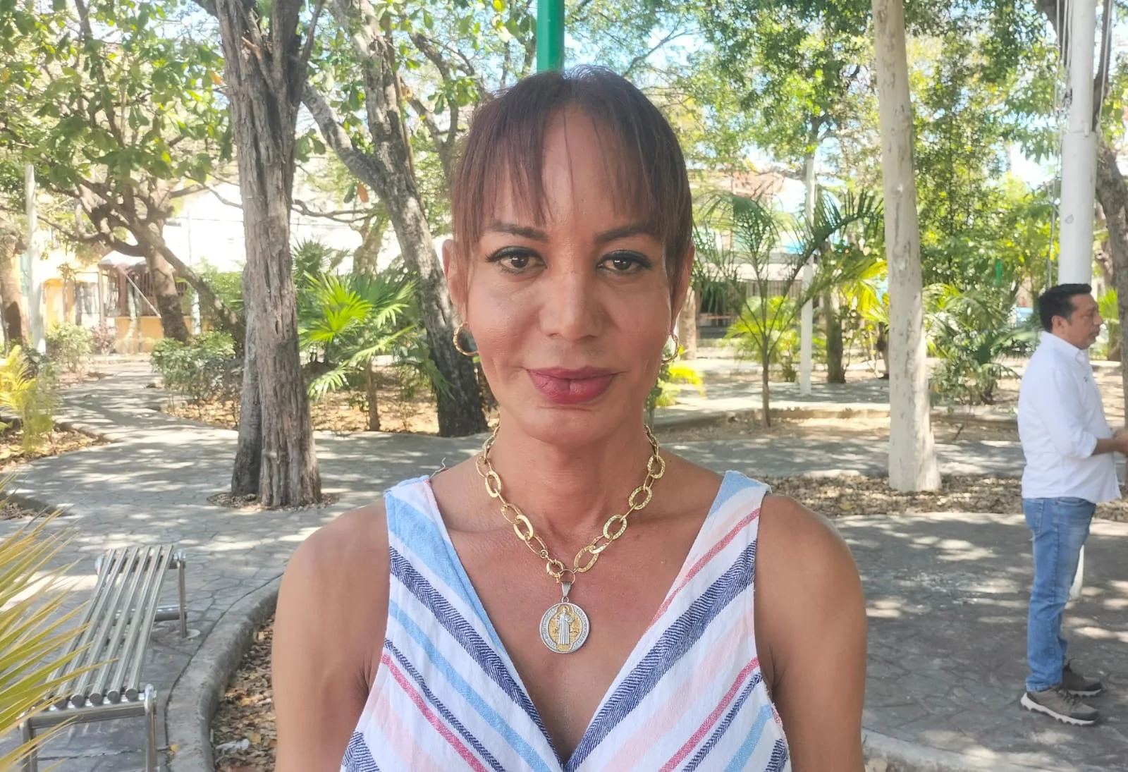 A person holding a gender identity document in Cancun