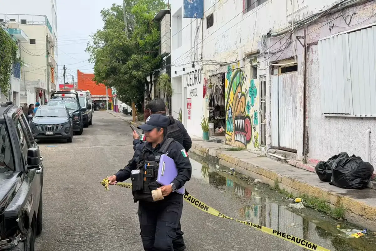 Police and emergency responders at a hotel in Cancún where a transgender woman was found dead