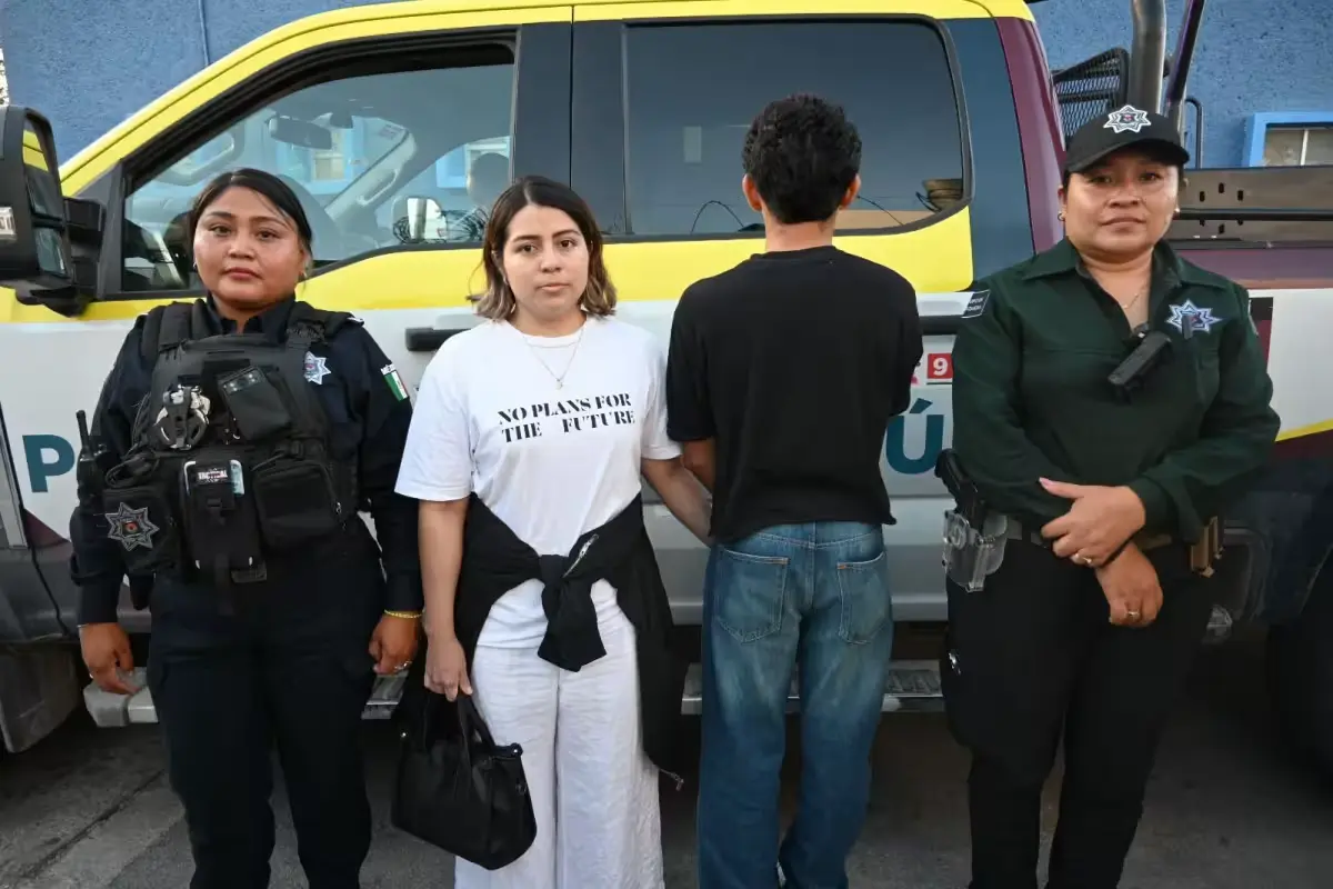 A teenager stands near a shopping center in Cancún after being located by police following a virtual kidnapping scam.