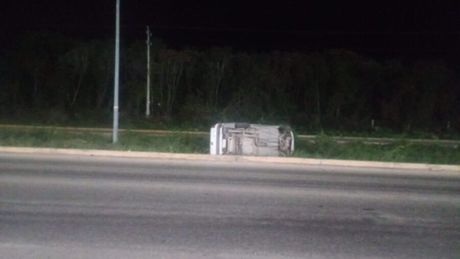 Emergency responders at the scene of a rollover crash caused by a Cemex concrete truck on Federal Highway 307 near Puerto Morelos