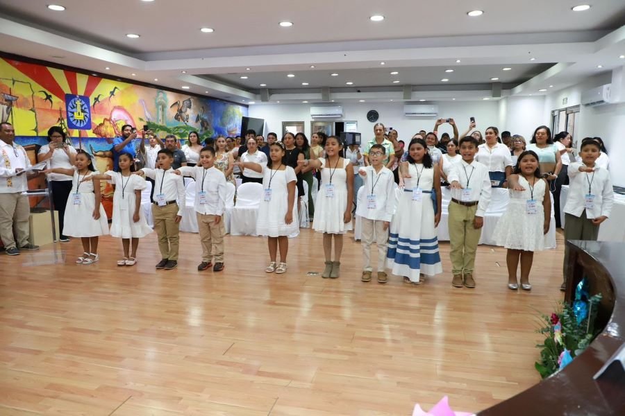 Children seated at a council table in Isla Mujeres for the Fifth Children's Council 2026