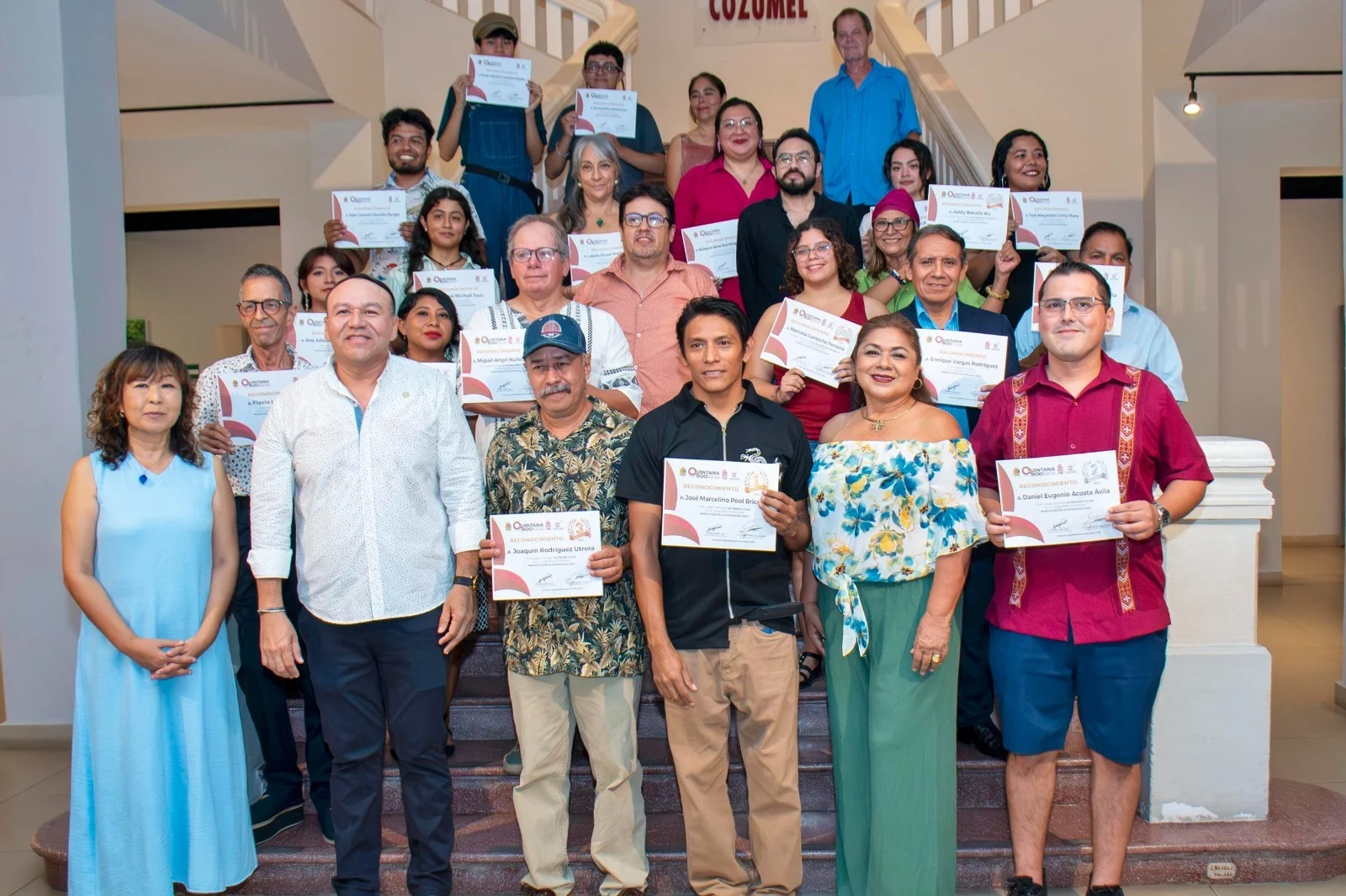 Winners and officials at the Cozumel Museum of the Island art competition ceremony