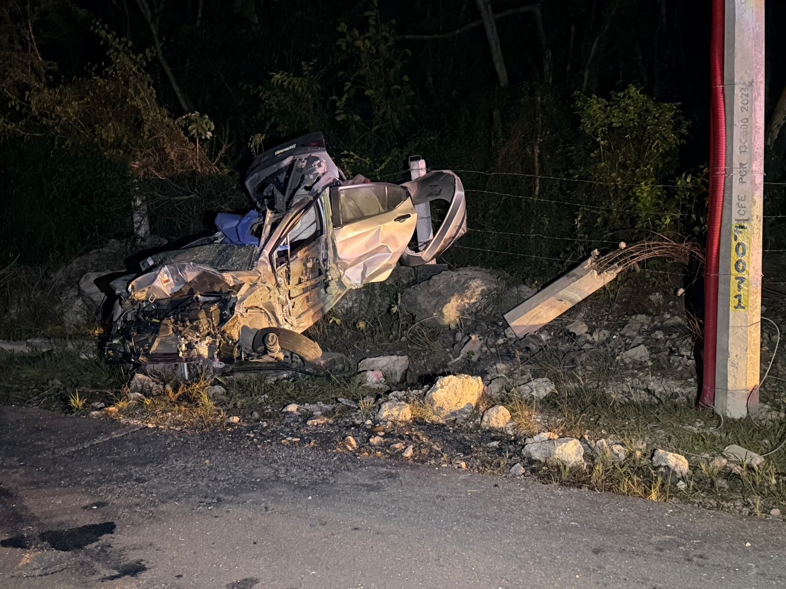 Police and emergency vehicles at the scene of a fatal car accident on the Merida-Cancun highway near Kantunil, Yucatan