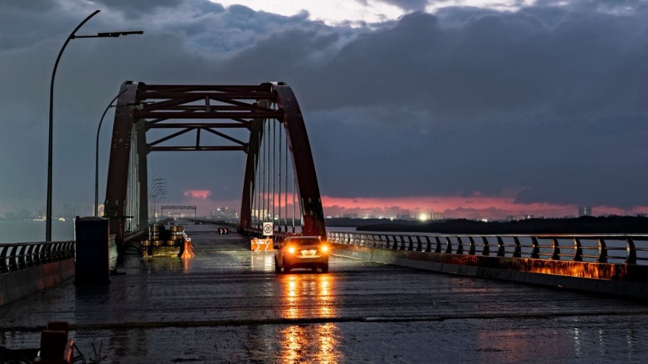 Cyclists riding across the new Nichupté Bridge in Cancun during a recreational event
