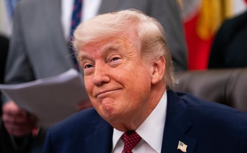 US President Donald Trump speaking at a podium during a public appearance