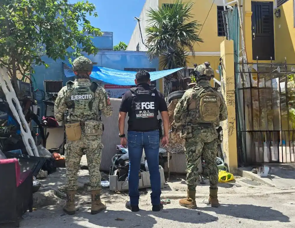 Photo showing seized drugs and surveillance equipment from raids in Quintana Roo