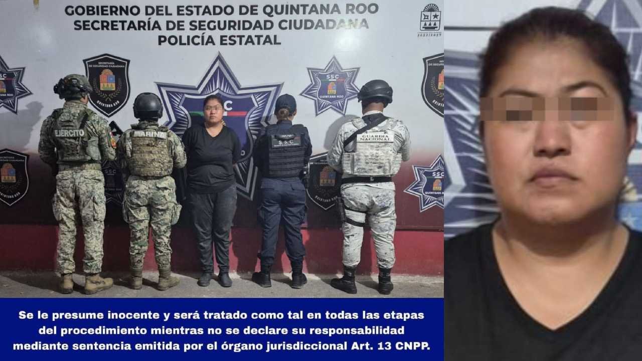 Police officers detain a woman in Villas Otoch Paraíso, Cancun