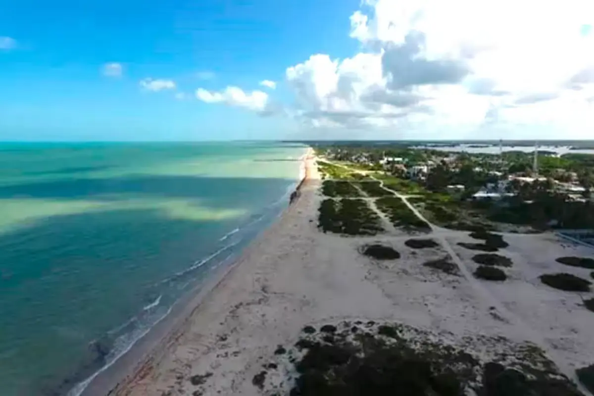 Coastal erosion on Yucatan beaches showing disappearing sand and exposed rocks