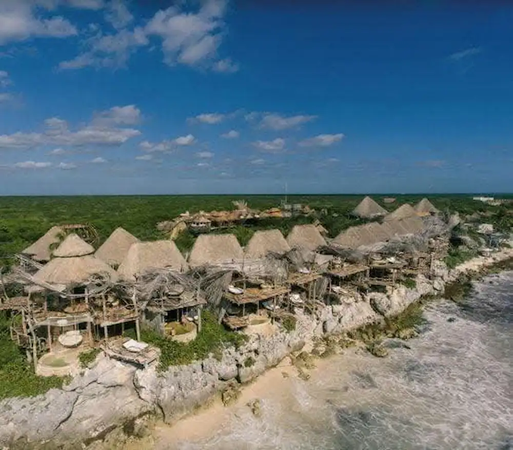 Aerial view of Hotel Azulik in Tulum showing expanded structures along the coastline