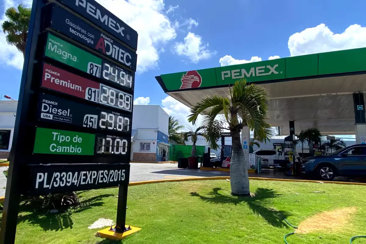 Gas station in Cancun showing fuel prices on a sign