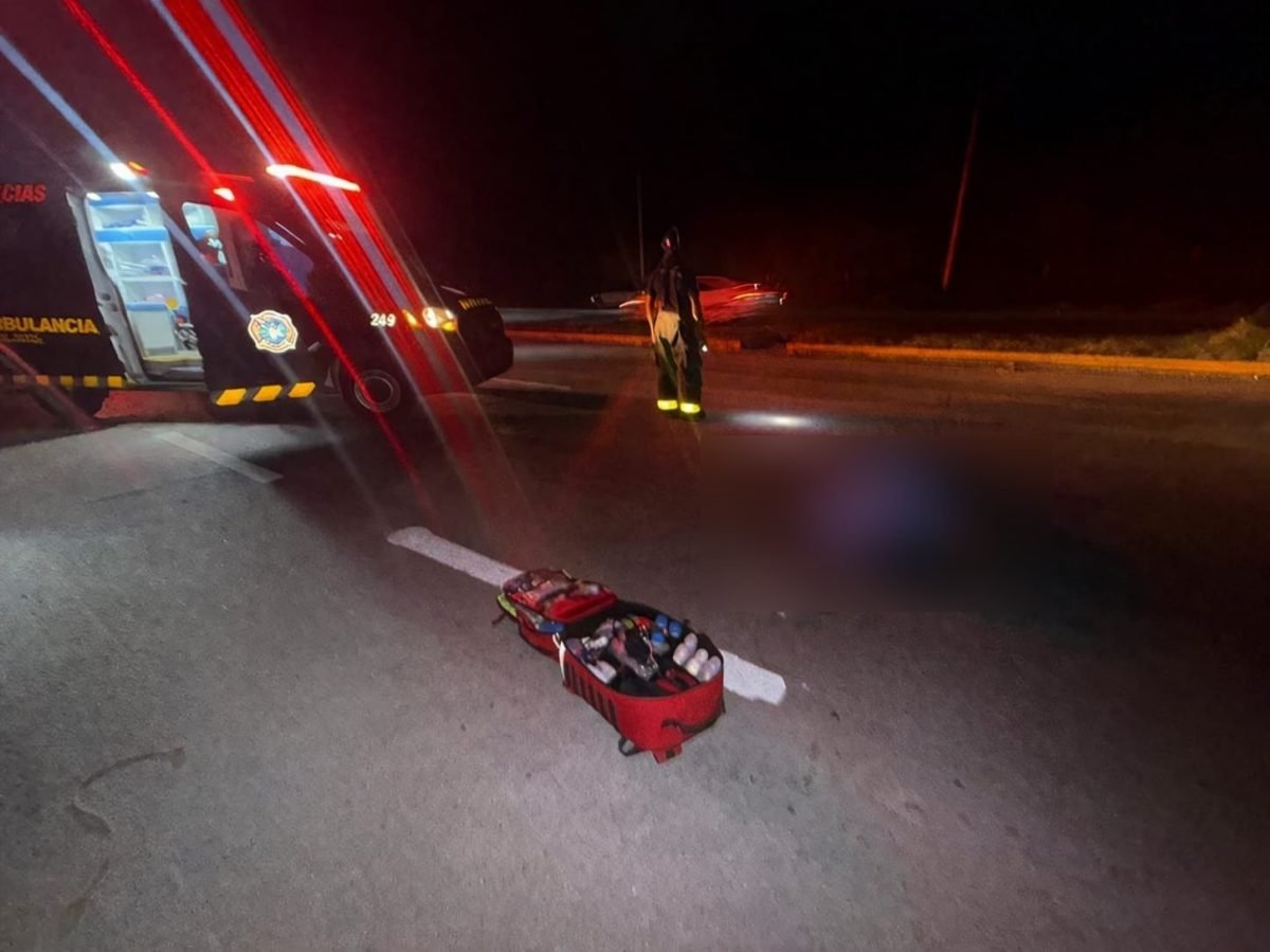 Emergency responders at the scene of a fatal motorcycle accident on Highway 307 near Puerto Aventuras