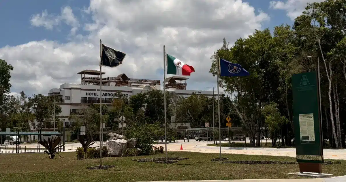 Exterior view of Hotel Tulum Aeropuerto with modern architecture and pool area
