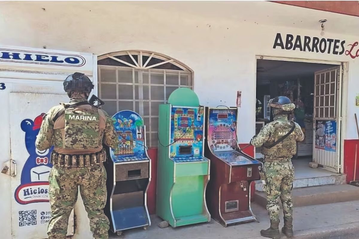 A stack of confiscated illegal slot machines in a warehouse