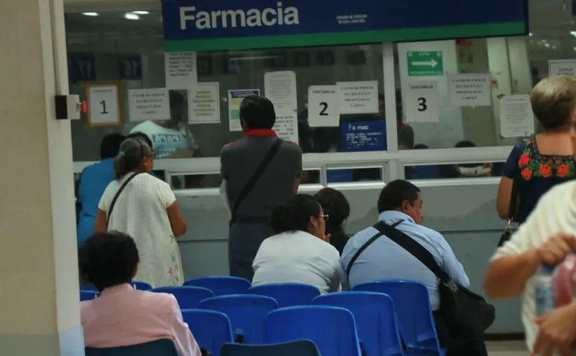 A medical professional holding a vial of Keytruda, a cancer immunotherapy drug, in a hospital setting
