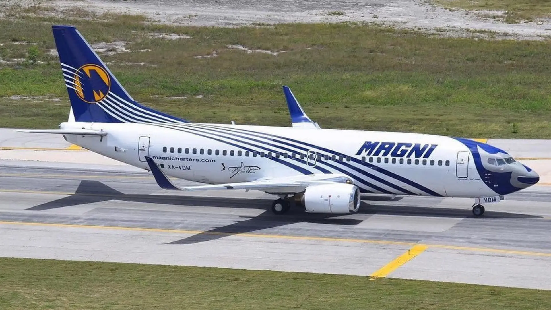 Passengers waiting at Cancún airport after Magnicharters flight cancellations