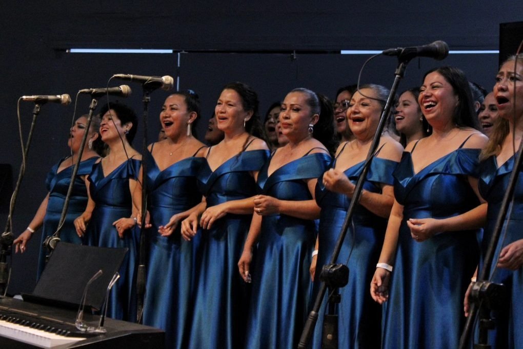 The Magnolias choir performing on stage in Playa del Carmen