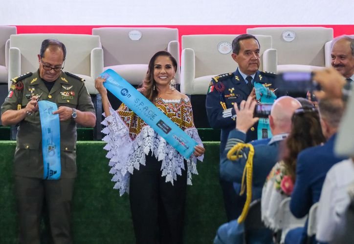 Governor Mara Lezama speaks at the opening ceremony of Tulum Air Show 2026 with military officials in the background