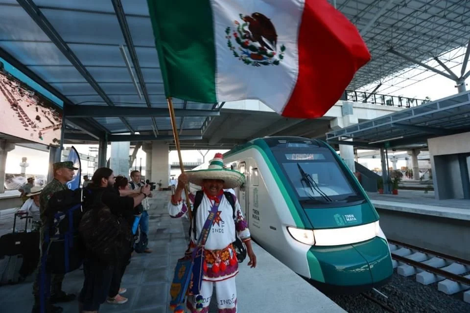 A bright white maintenance center of the Maya Train surrounded by dense jungle in Quintana Roo, Mexico.