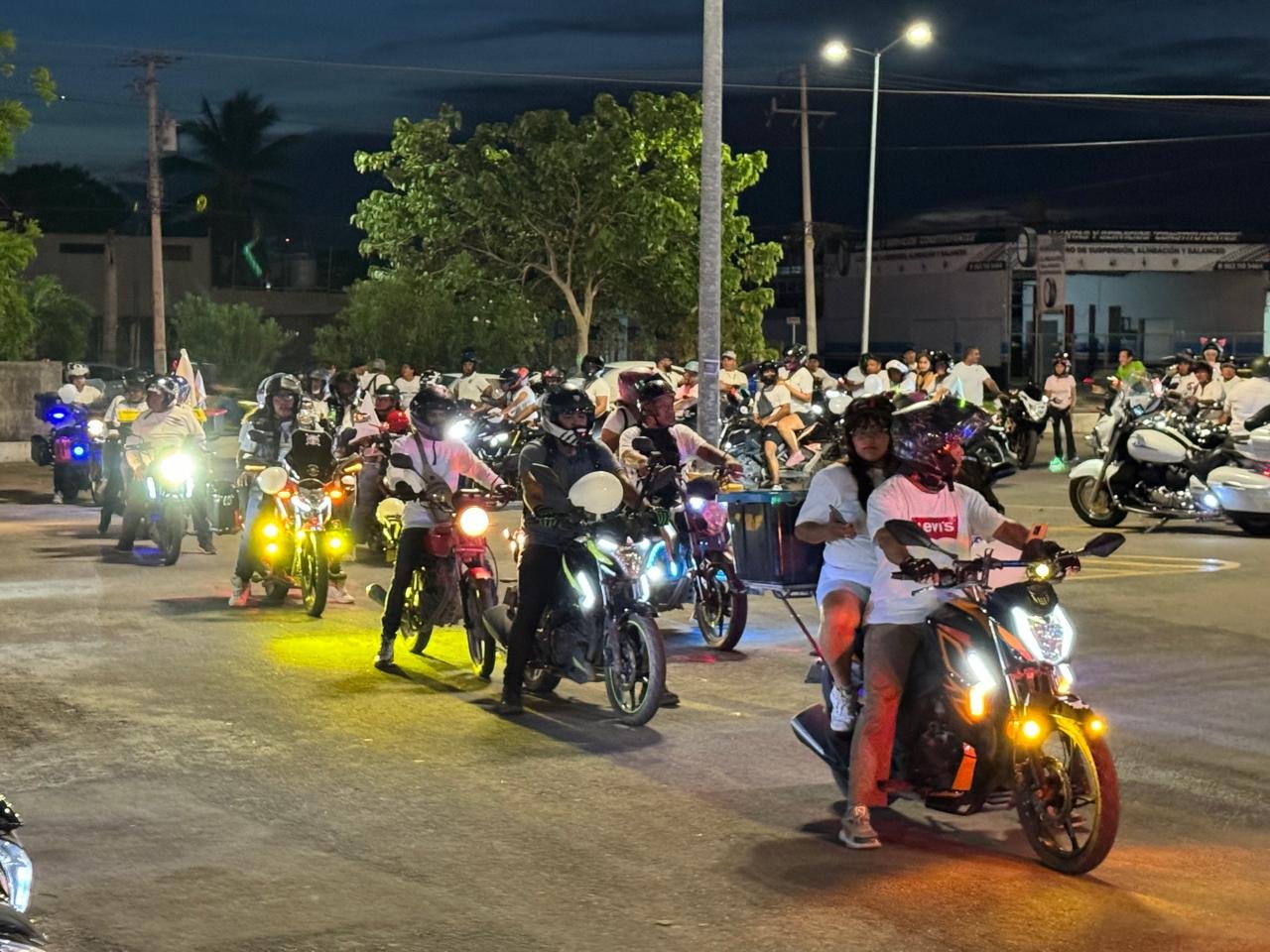 Motorcyclists gathered in Playa del Carmen discussing designated riding areas