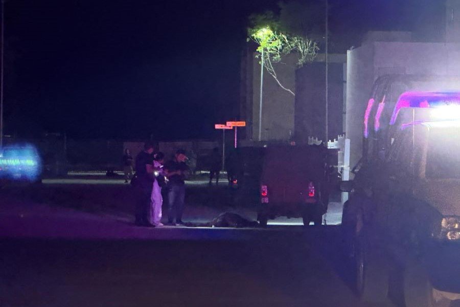 Police and forensic investigators at the scene where a mototaxi driver was shot dead in Cancun