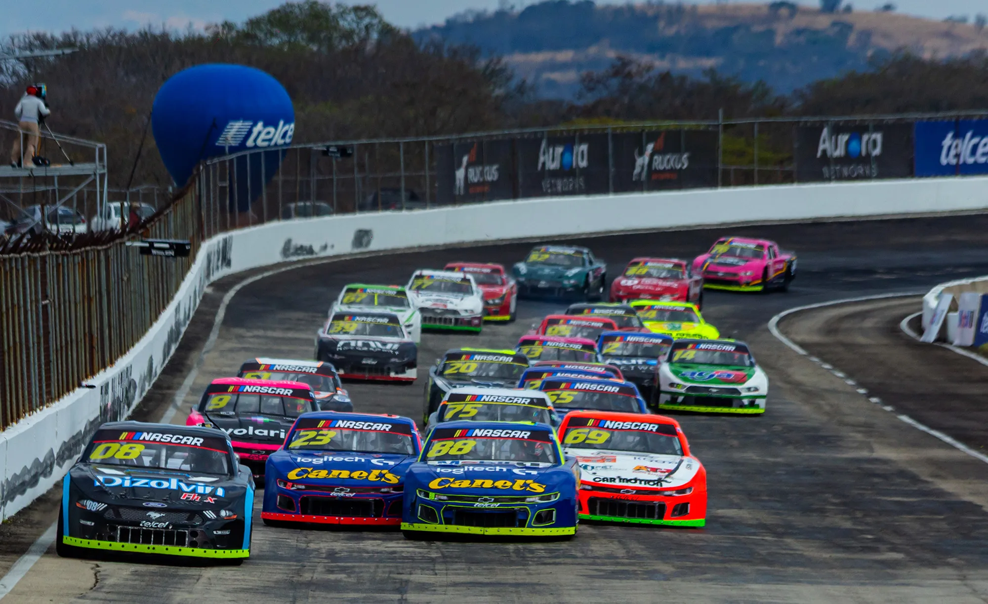 NASCAR Mexico Series car racing on a temporary oval track at Tulum International Airport