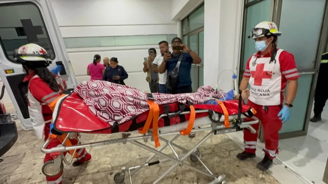 Police officers cordon off the area after a mototaxi driver was shot in Cancun