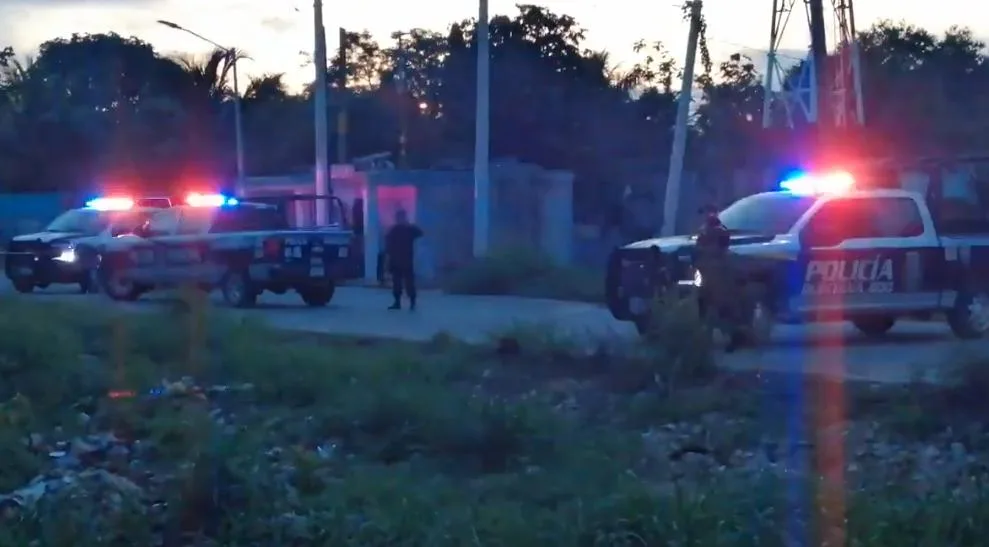 Police and forensic investigators at the scene of a fatal accident on a dirt road in Cancun