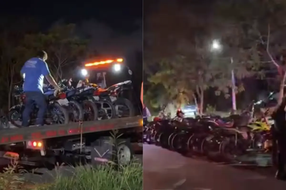 Police officers standing beside seized motorcycles during an operation in Cancun