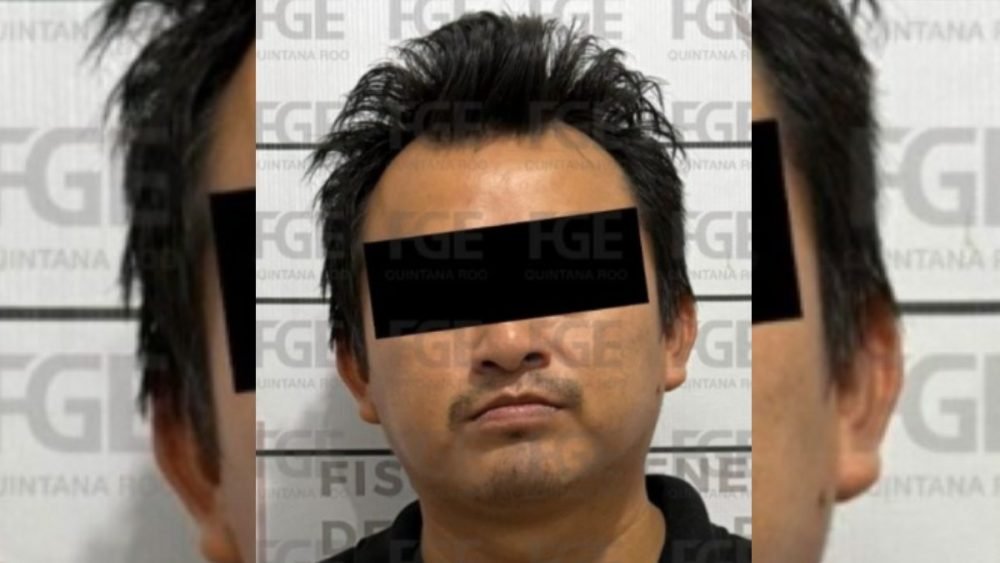 A person in handcuffs being led by police officers