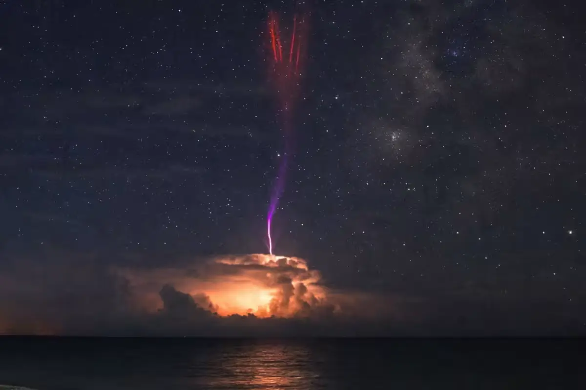A rare red sprite, a high-altitude electrical discharge, photographed over the Yucatan coast at night