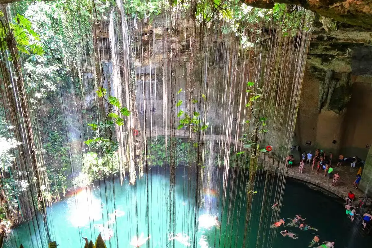 The Sacred Cenote of Cobá, a natural sinkhole surrounded by jungle in the Cobá archaeological zone, Quintana Roo