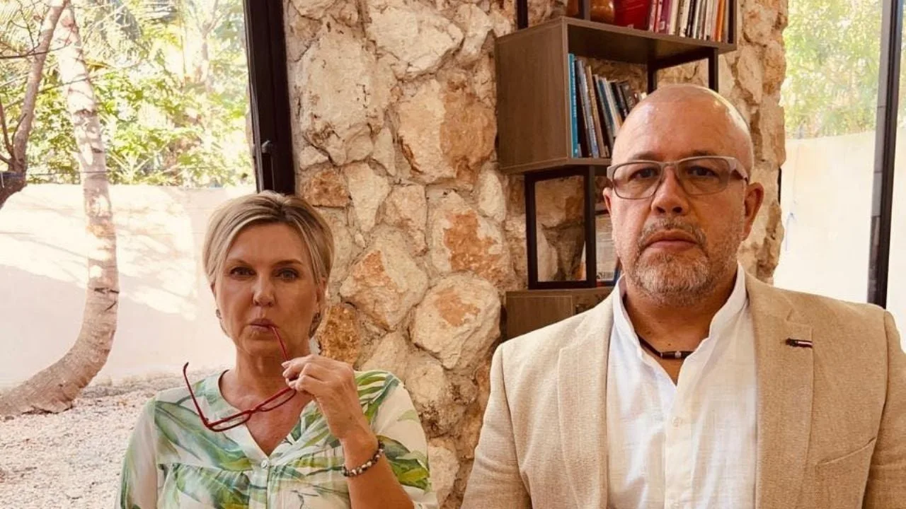 Samuel Acuña and Viktoriya Ankudinova, business owners in Bacalar, speaking at a press conference